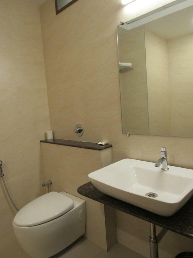 Palguni Residency Hotel Хасан Екстериор снимка